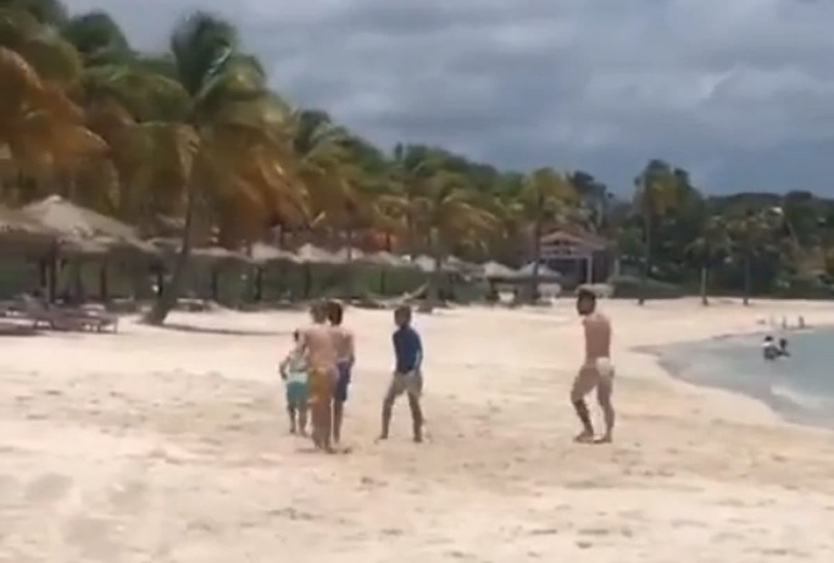 Lionel messi plays football on caribbean beach with school kid