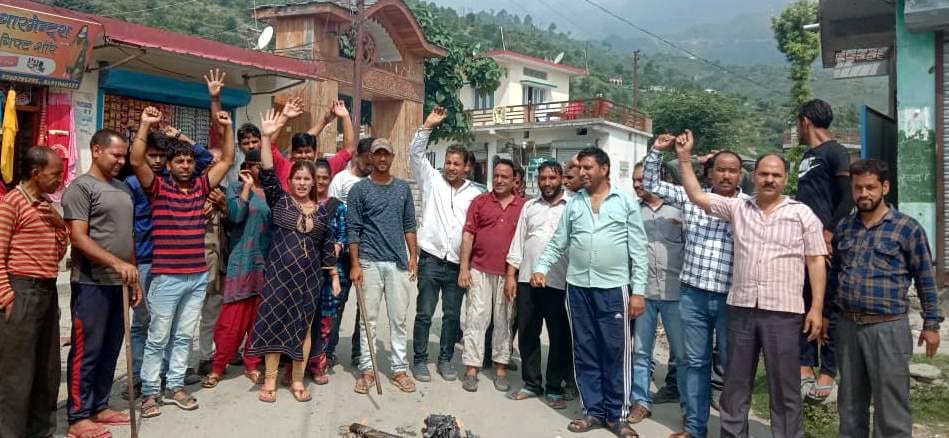 Charged allegations of blocking the development of the area, blasted effigy