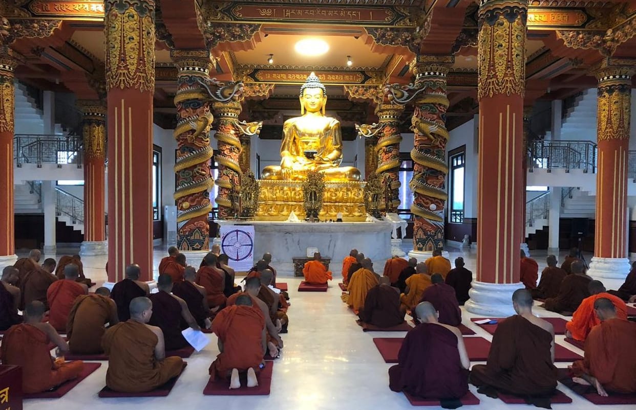 Buddhist followers worship varsavas