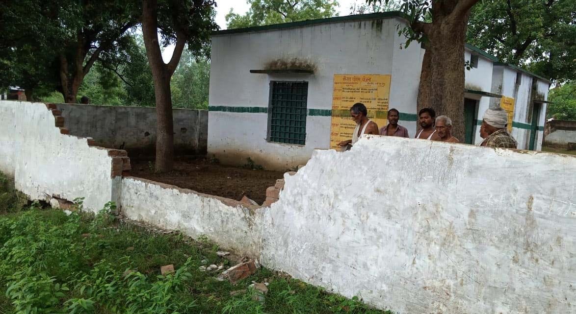 Dashed school wall and gate, fleeing cattle
