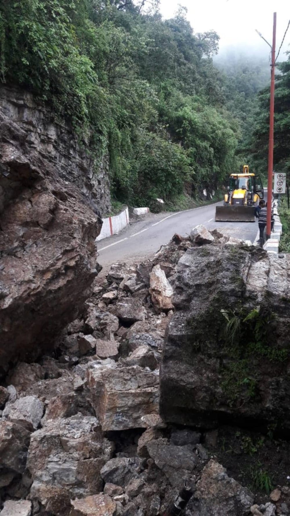 Heavy boulder fallen from the hill on the Mussoorie-Dehradun route