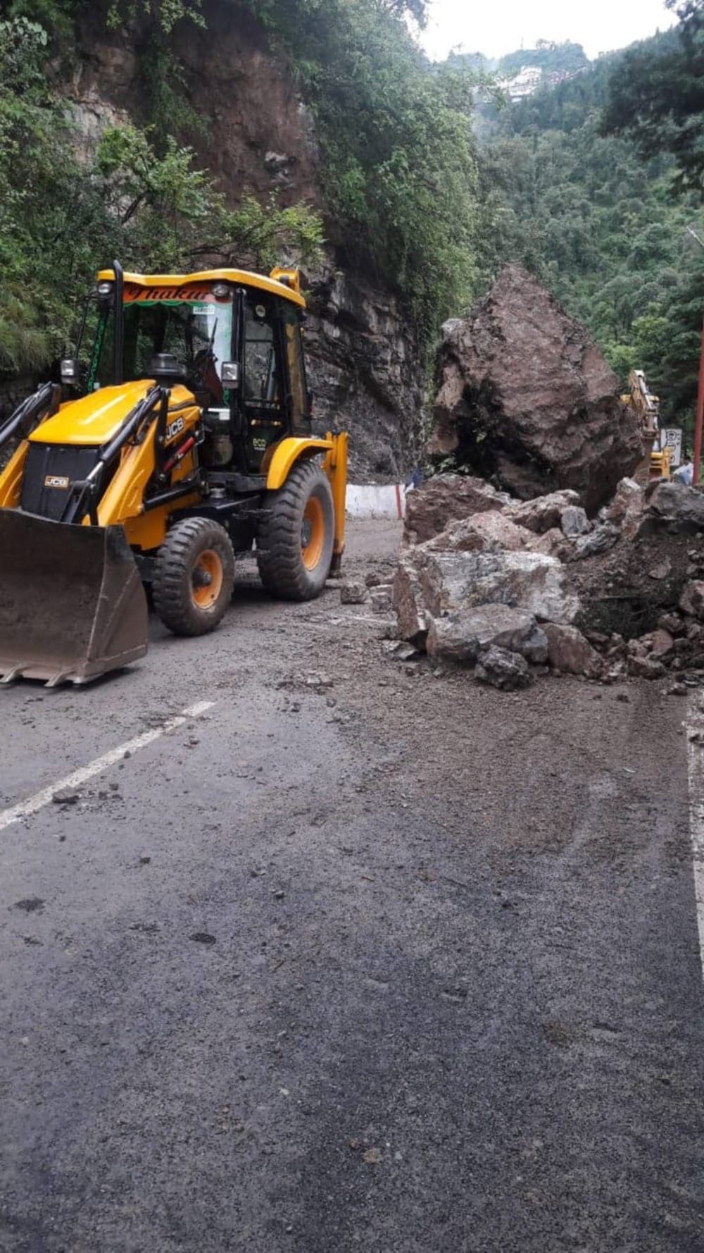 Heavy boulder fallen from the hill on the Mussoorie-Dehradun route