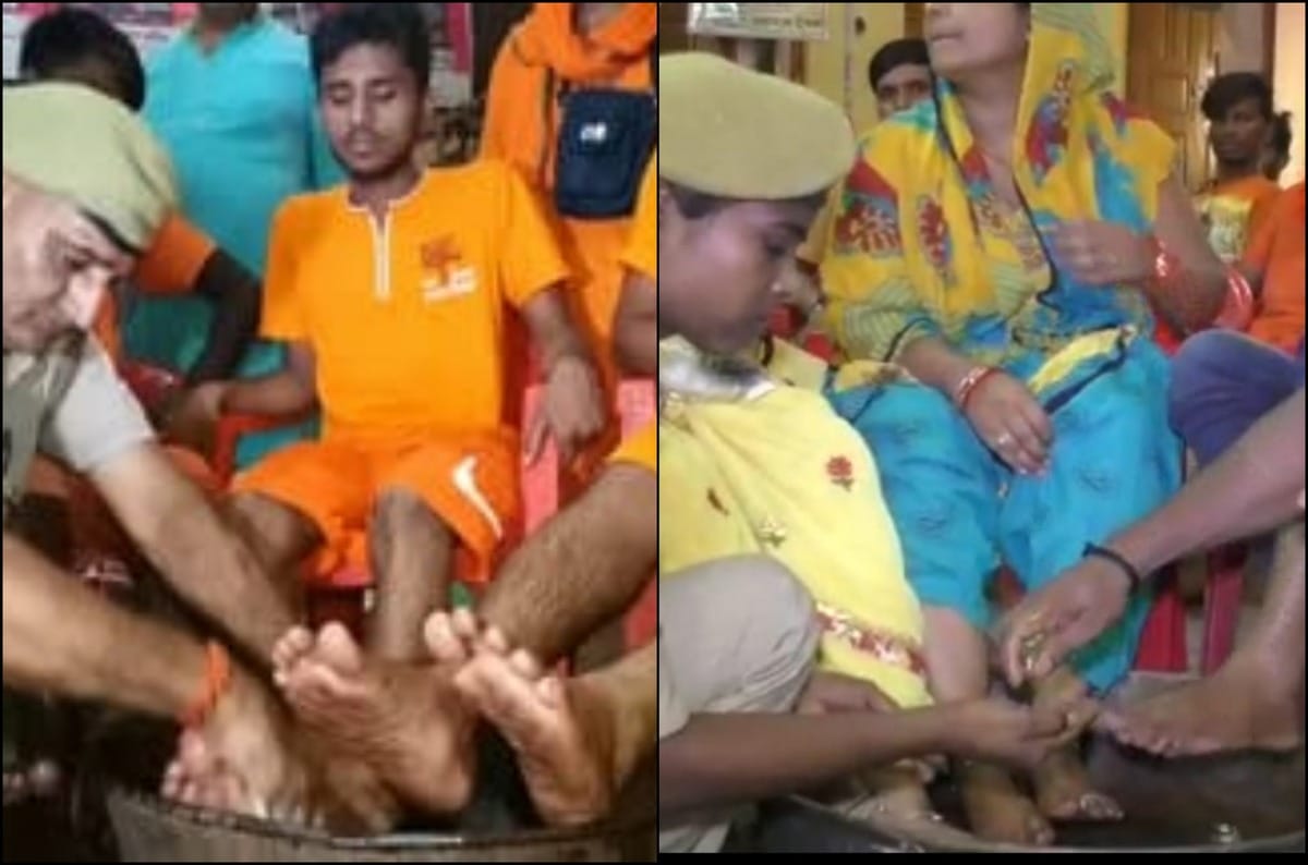 police wash feet of kanvariya in camp laksa varanasi kashi