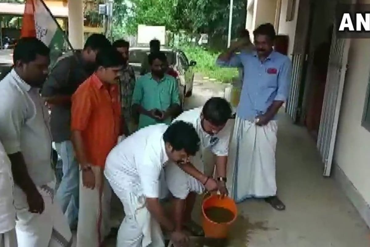 Congress activists purified premises of PWD office with cow dung because CPI MLA protested there