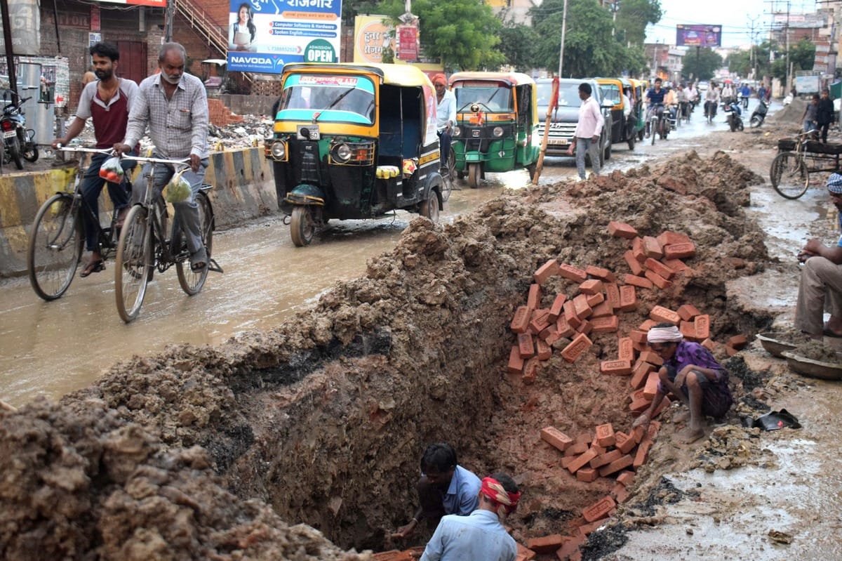 waterlogging raod narrow traffic jam after rain in manduadih varanasi