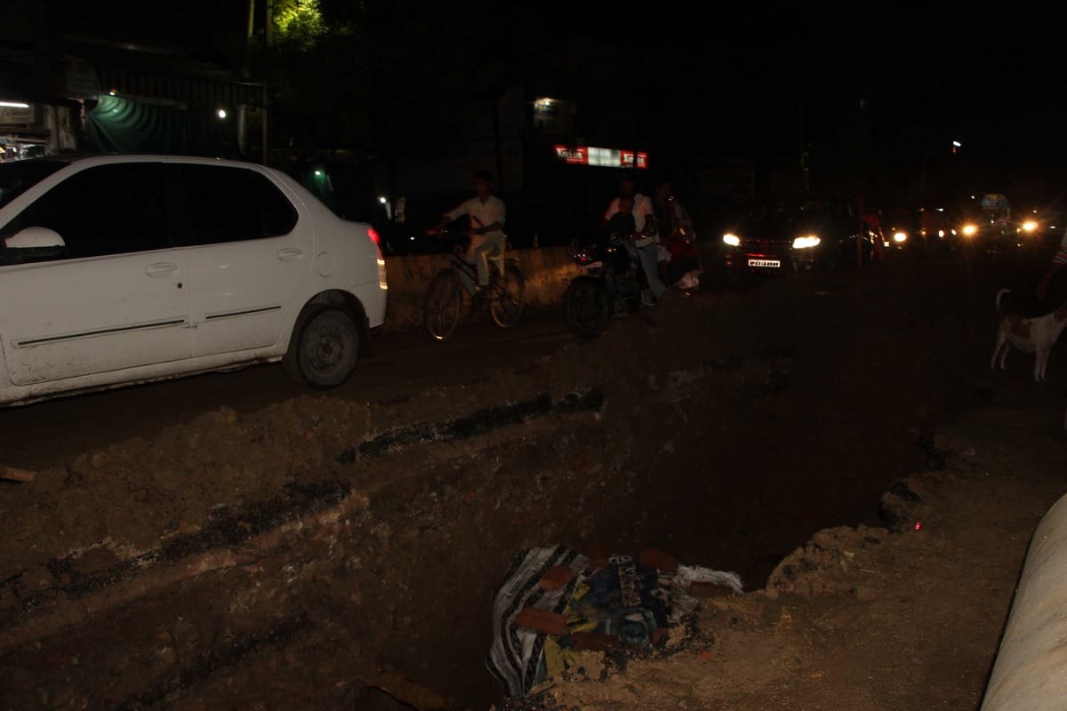waterlogging raod narrow traffic jam after rain in manduadih varanasi