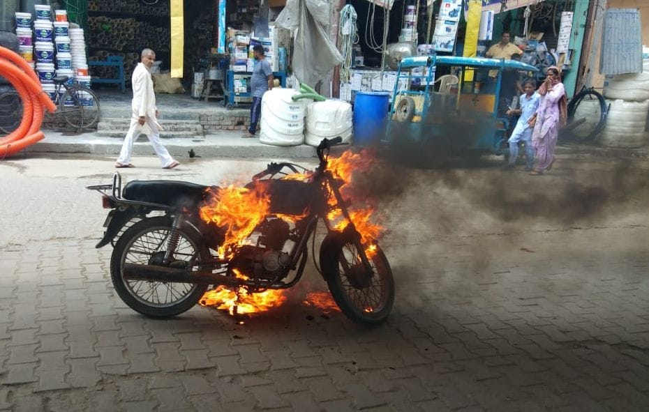 boy burns bike during police checking