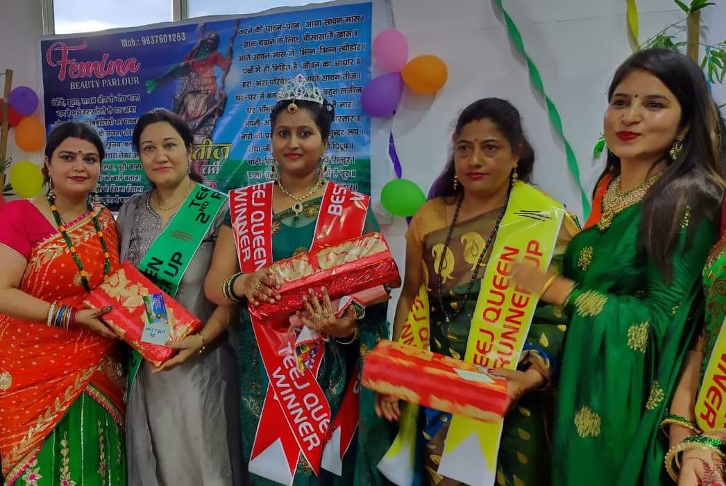 Madhu and Parvati's head decorating Tee Queen's crown