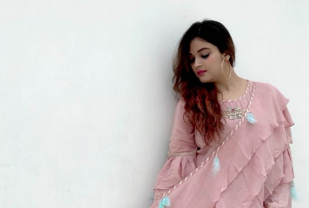 Ruffle dress and saree prepared by fashion designer Shikha suri