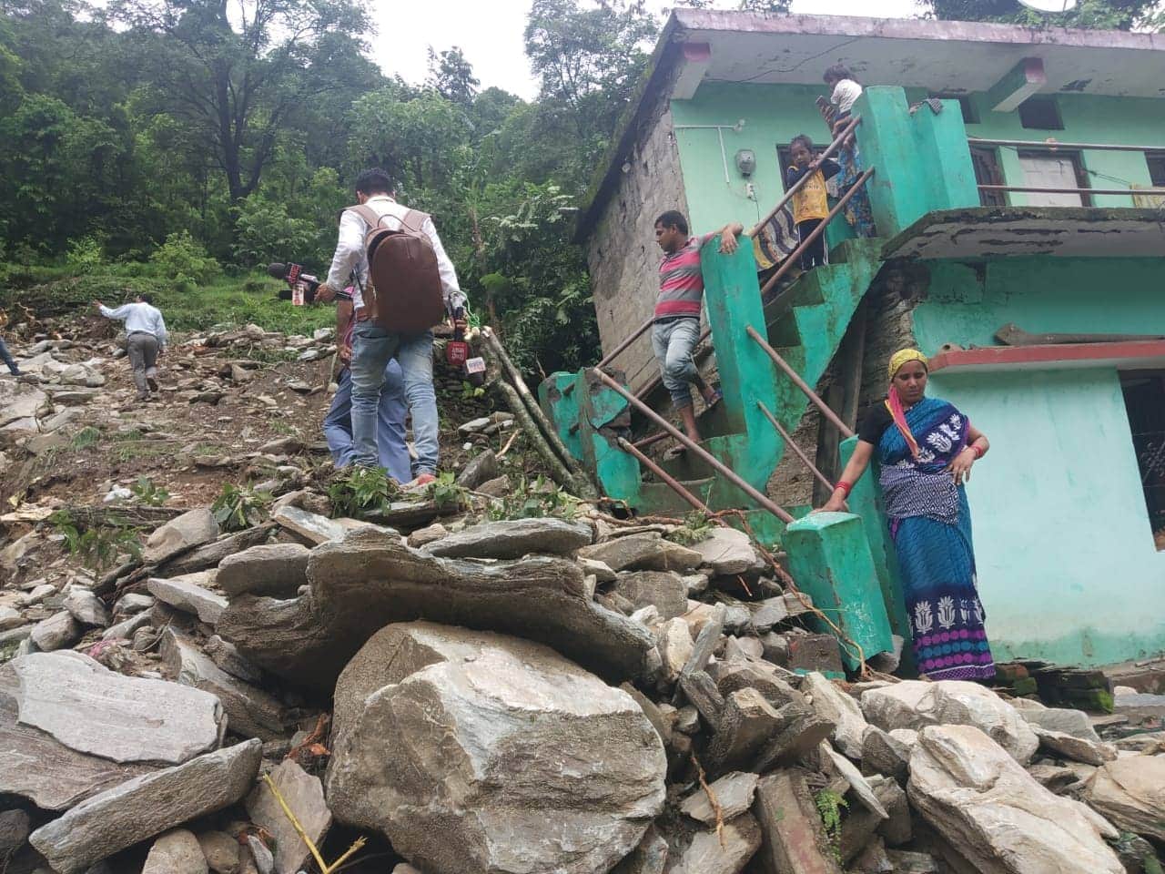 rain in all night in rudraprayag district house and vehicle buried in debris