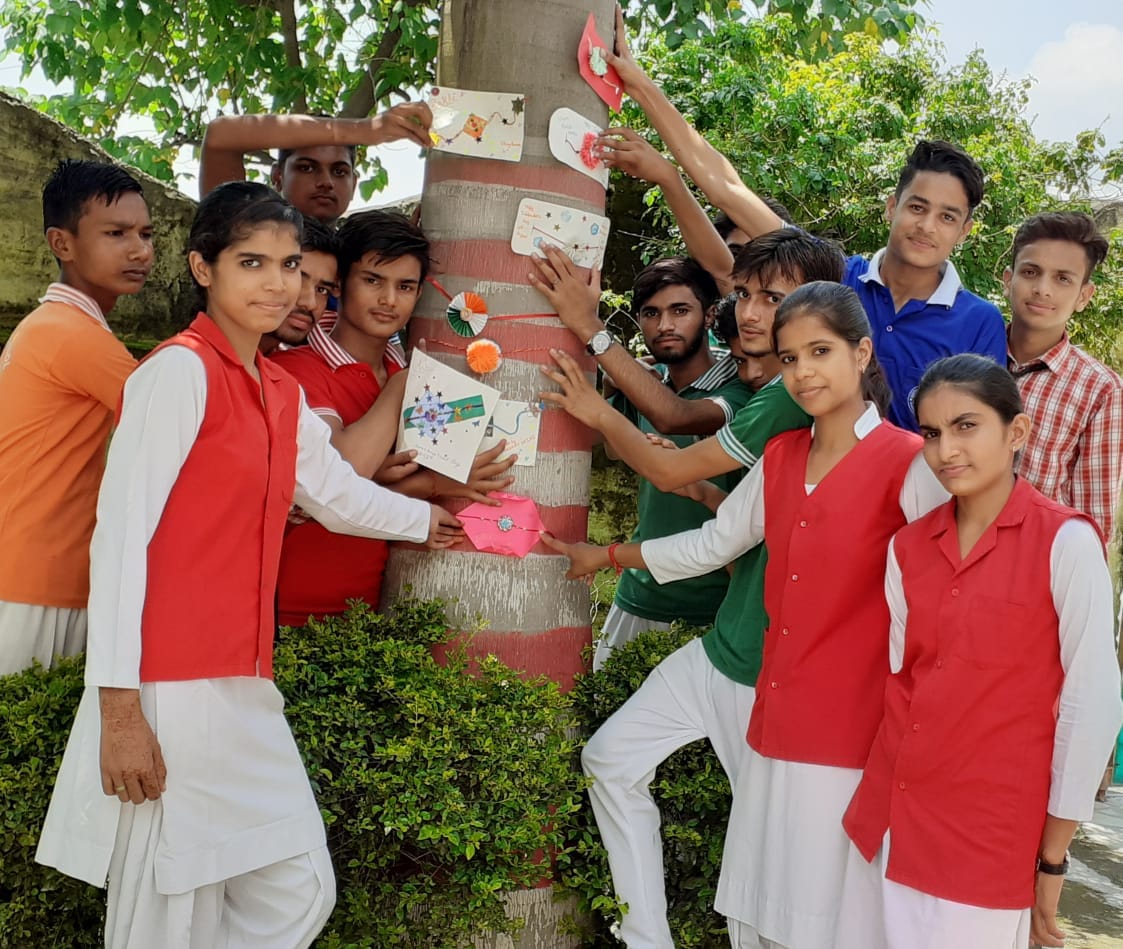 Resolve to protect trees by tying a rakhi