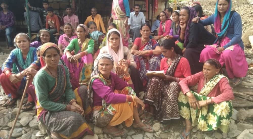 Women stand against mining reminding Chipko movement