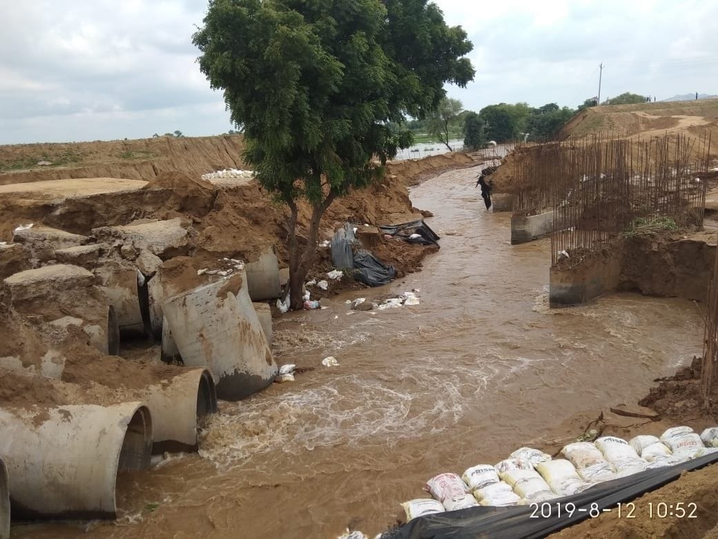 Due to release of the dam water into the canal, culvert, a dozen villages were cut