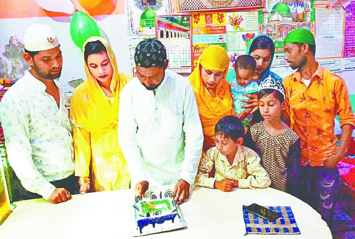 muslim family celebrate eid ul adha bakrid by cutting cake in agra