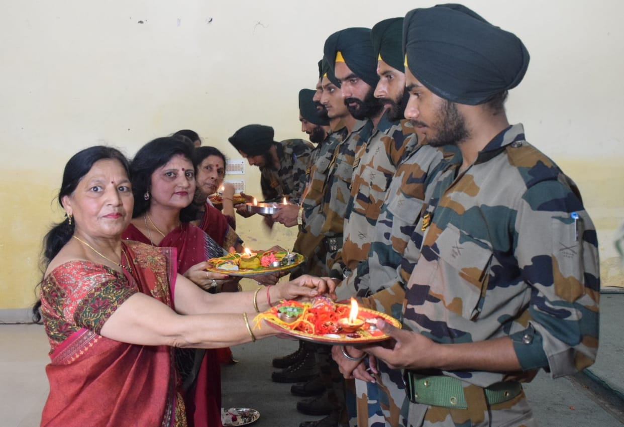 women tied rakhi soldiers wrist