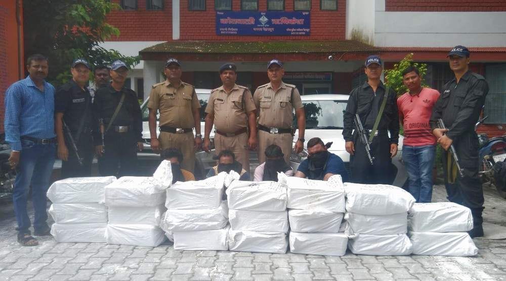 Four arrested with 20 cases of English liquor.