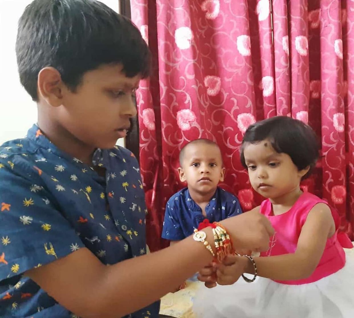 Sisters tied affection in brother's wrist