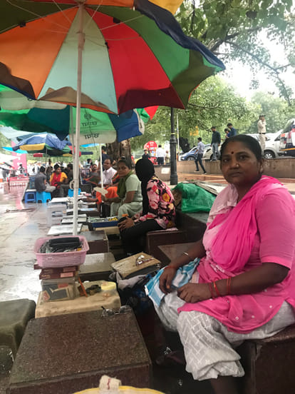 Shoe keepers earning rs 1 lakh per month at Connaught Place Hanuman Temple