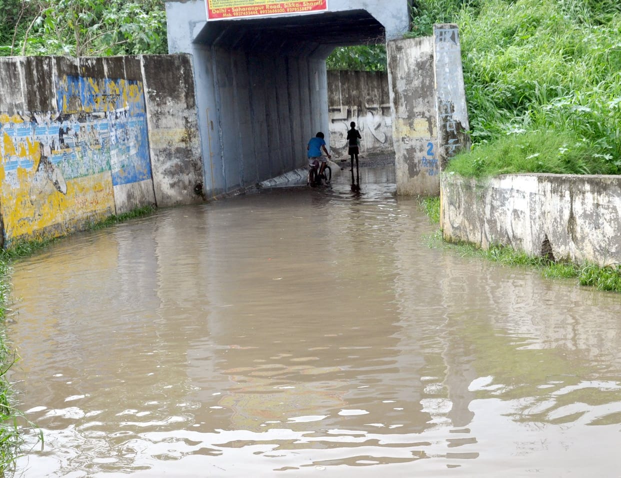 underpass flooded people upset