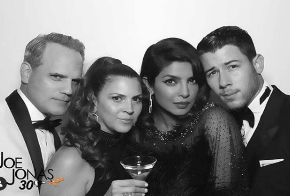 priyanka chopra reached in black dress with nick jonas at joe jonas birthday party