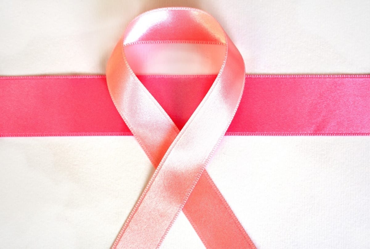 know about the symptom of breast cancer in male