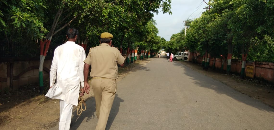 Policemen running in fun by handcuffing the criminal hand