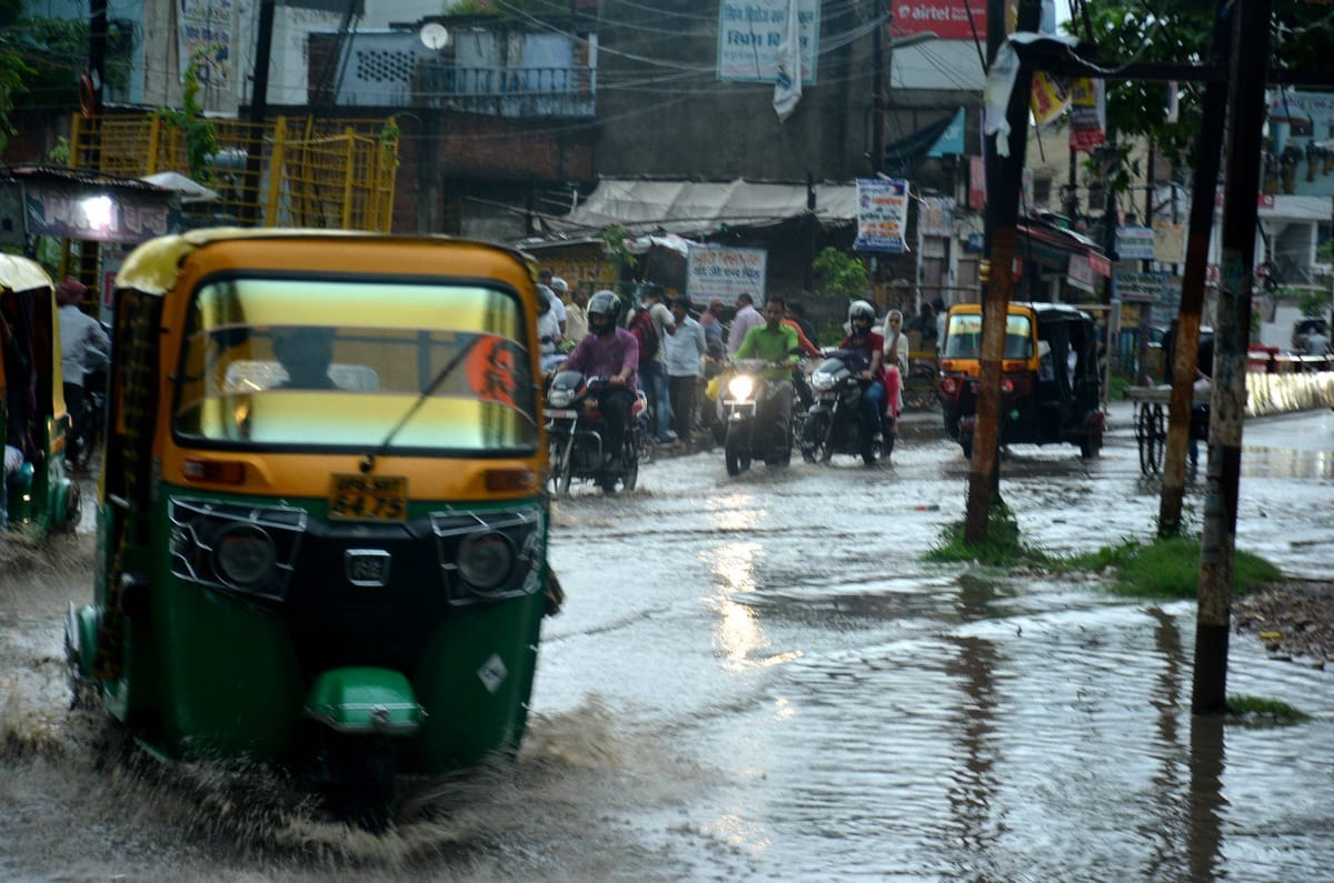 water logging on road shop traffic jam in varanasi