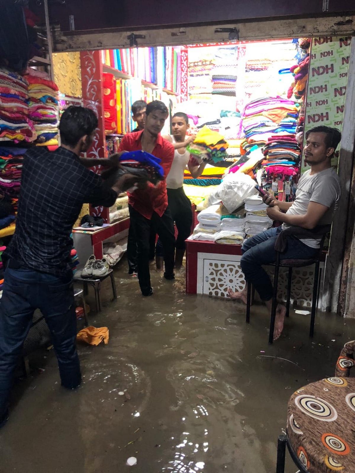 water logging on road shop traffic jam in varanasi
