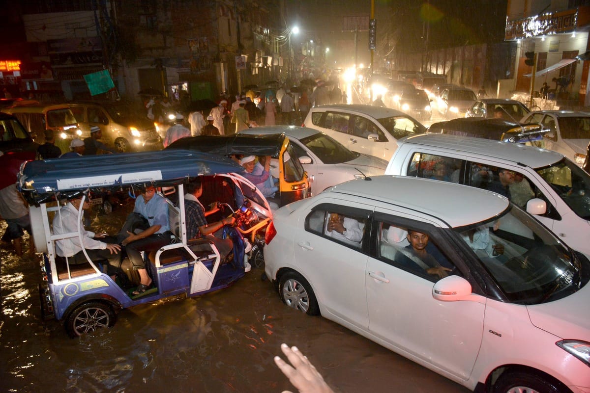 water logging on road shop traffic jam in varanasi