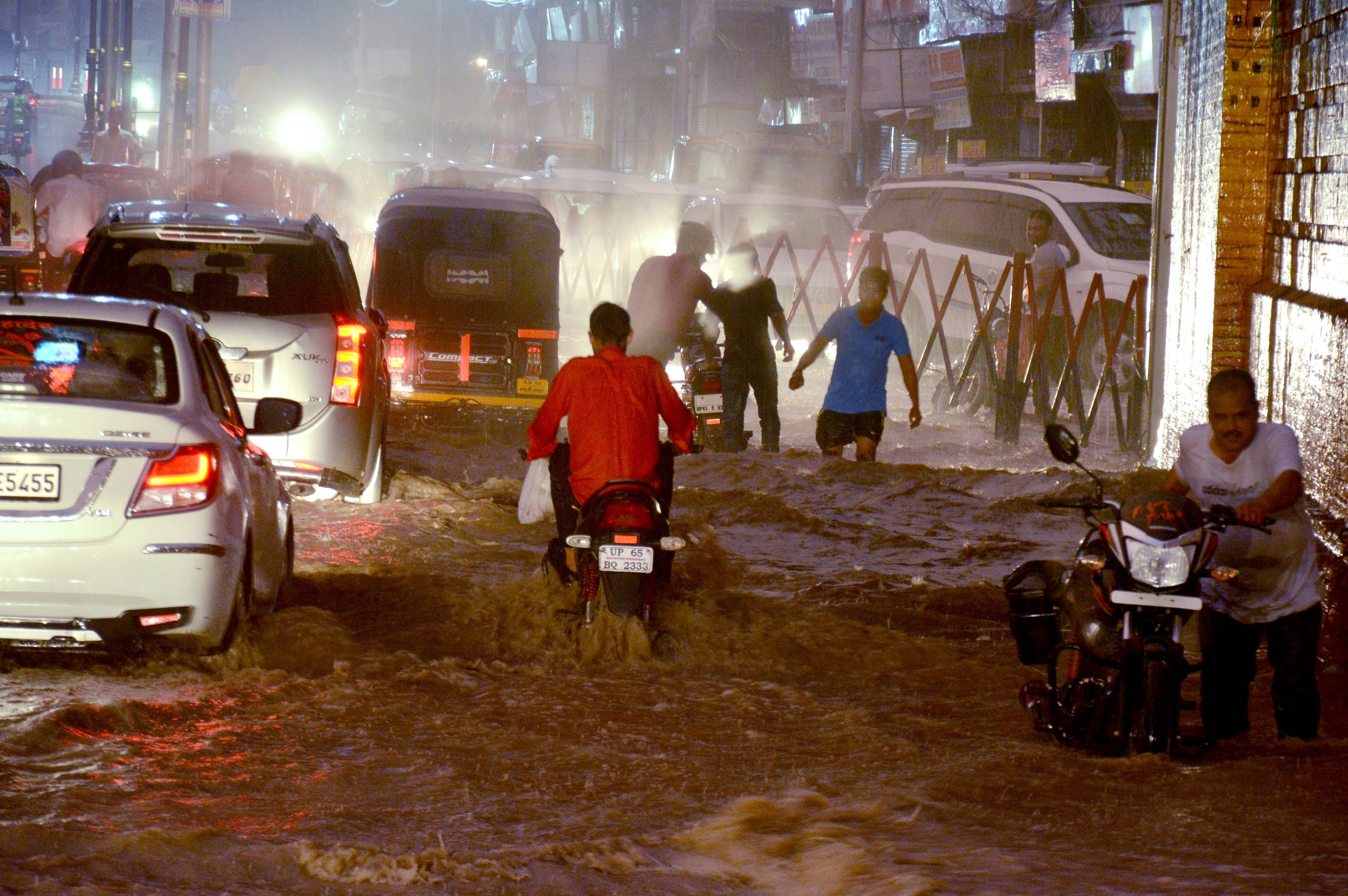 water logging on road shop traffic jam in varanasi
