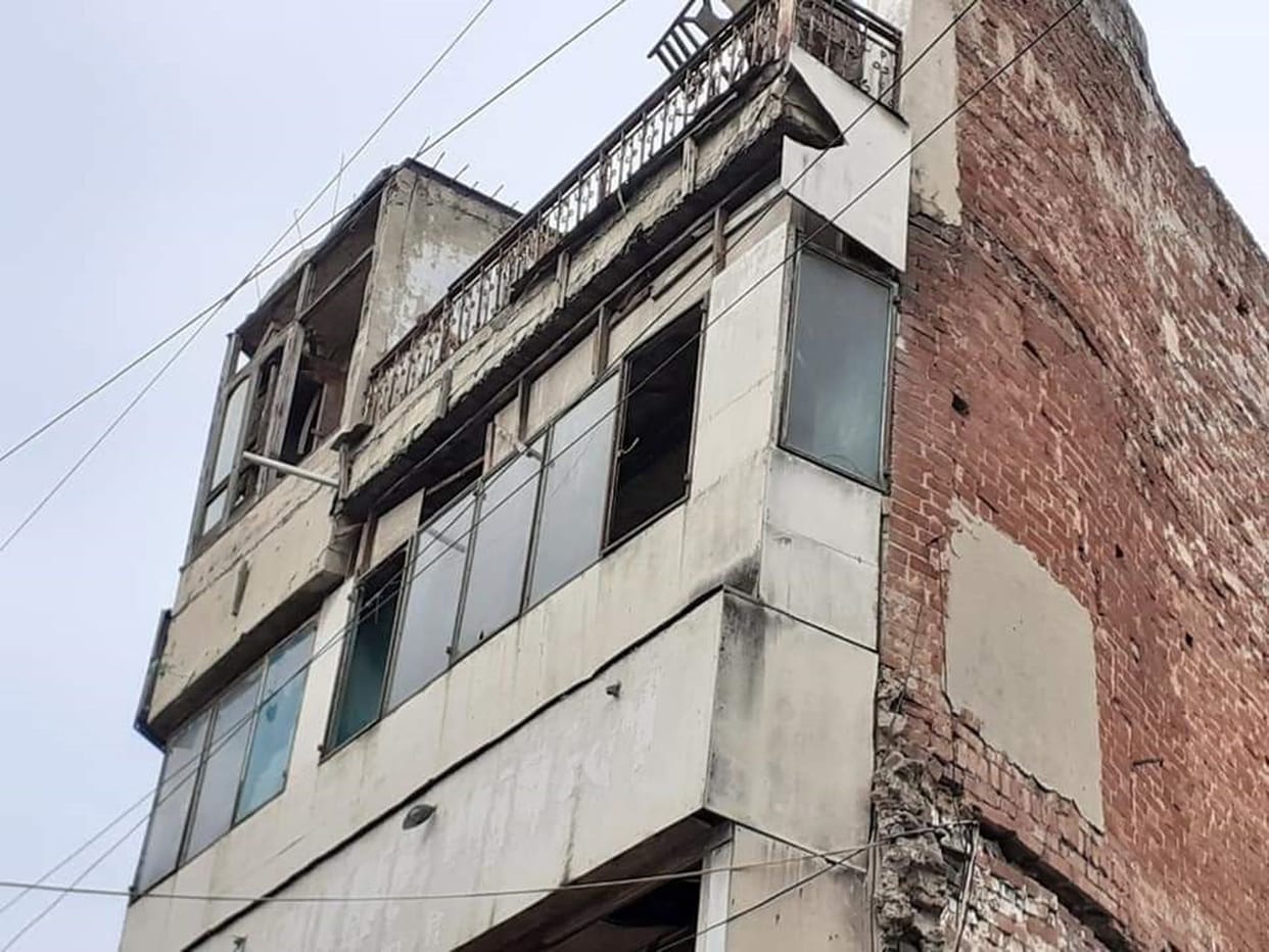building fell due to rain.
