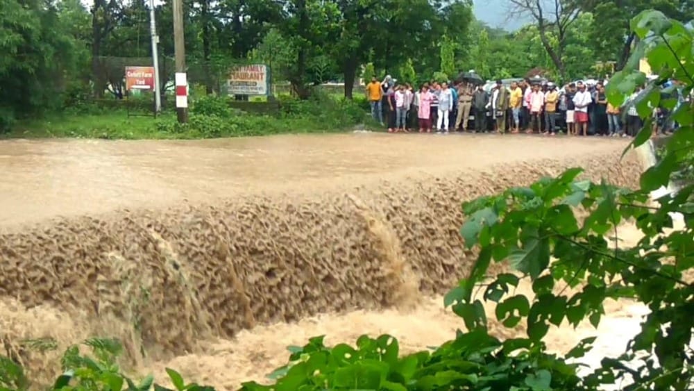 uttarakhand weather heavy rain rainy river overflow road swept