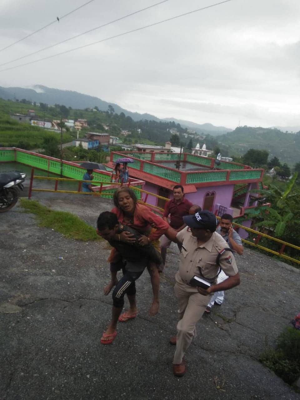uttarakhand weather heavy rain rainy river overflow road swept