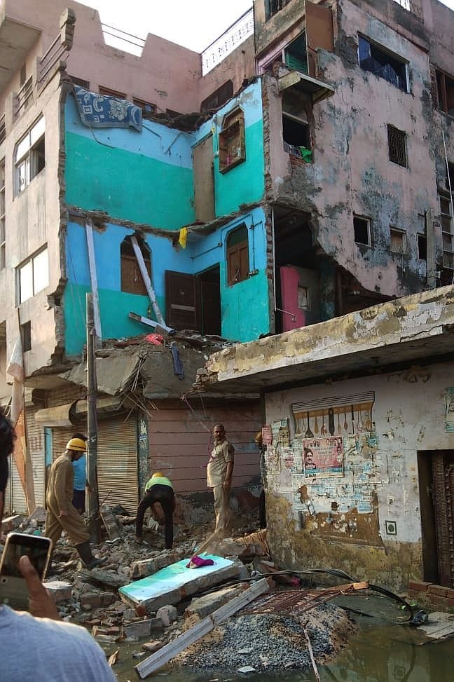 Part of a three-storey building fell, the woman died