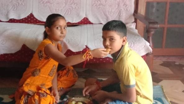Sister ties Rakhi to Brother