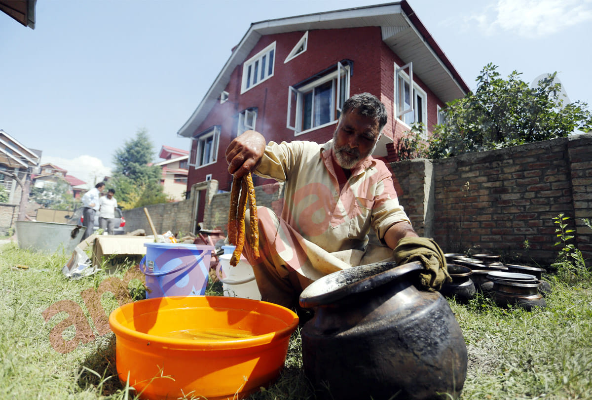 Waza or cook in Kashmiri traditions cooks prepares food for a traditional Wazwan feast