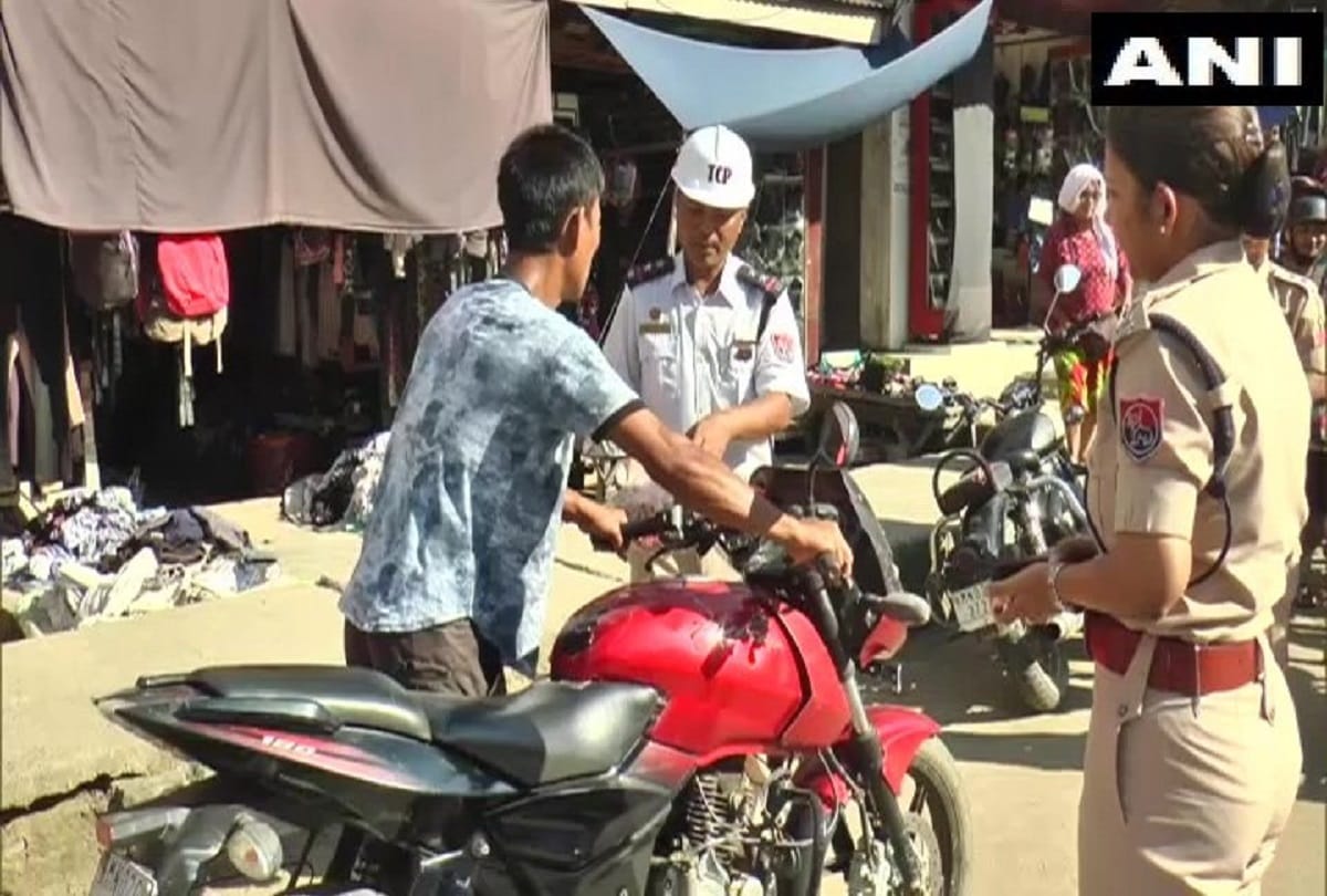 Manipur Churachandpur Traffic Police distributes sweets to helmet-less bikers instead of fining them