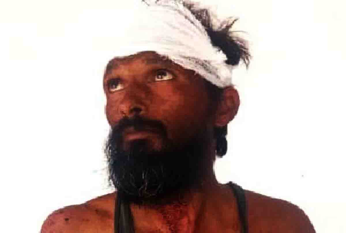 villagers beating a mentally ill man tied tree as he is a children thief