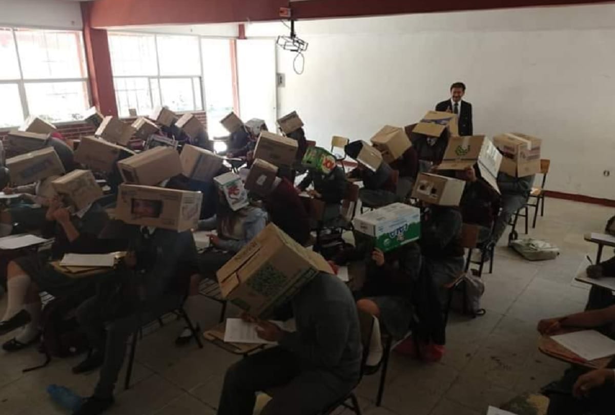 Teacher enrobe Cardboard Boxes to students to stop Cheating on Exam