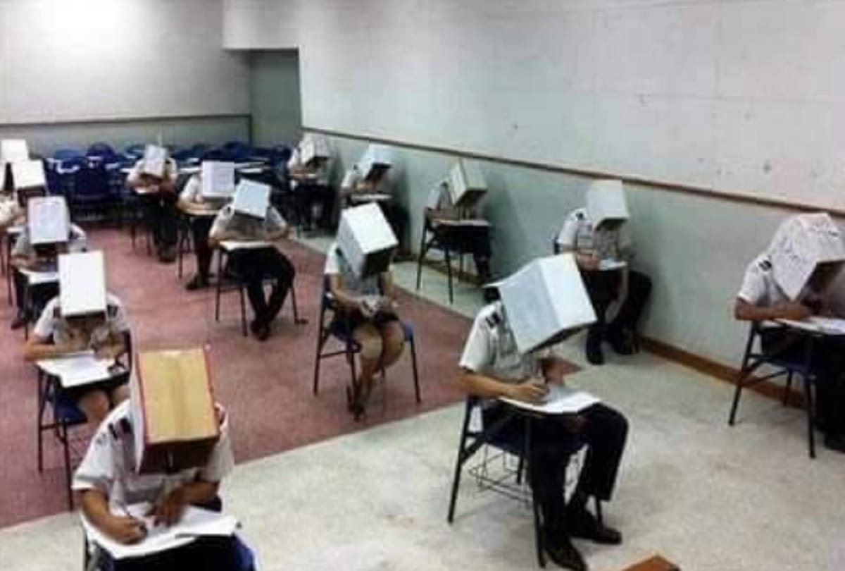 Teacher enrobe Cardboard Boxes to students to stop Cheating on Exam