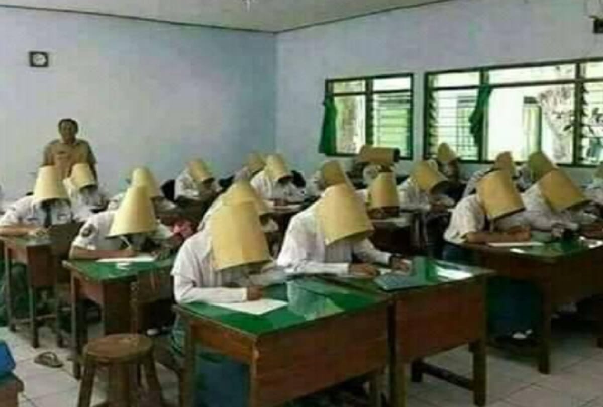 Teacher enrobe Cardboard Boxes to students to stop Cheating on Exam