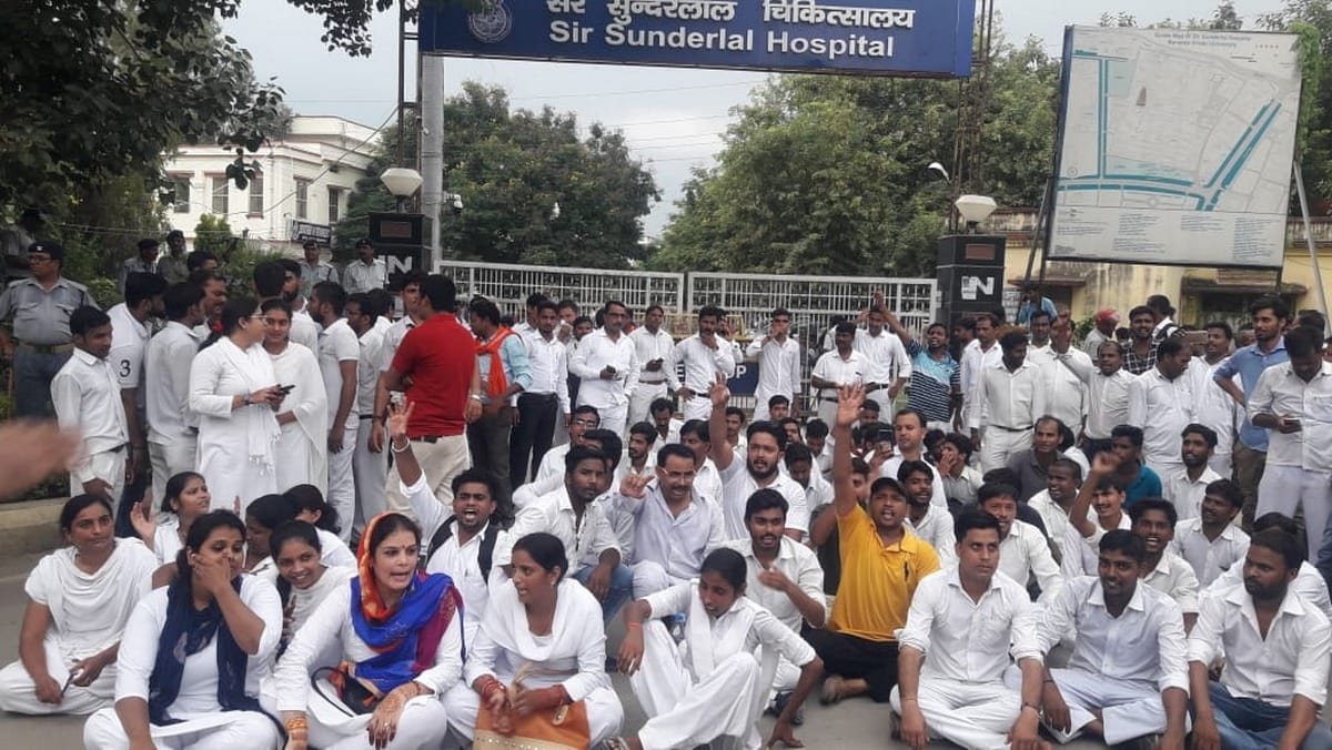 bhu trauma center mts employees protest against not getting salary varanasi