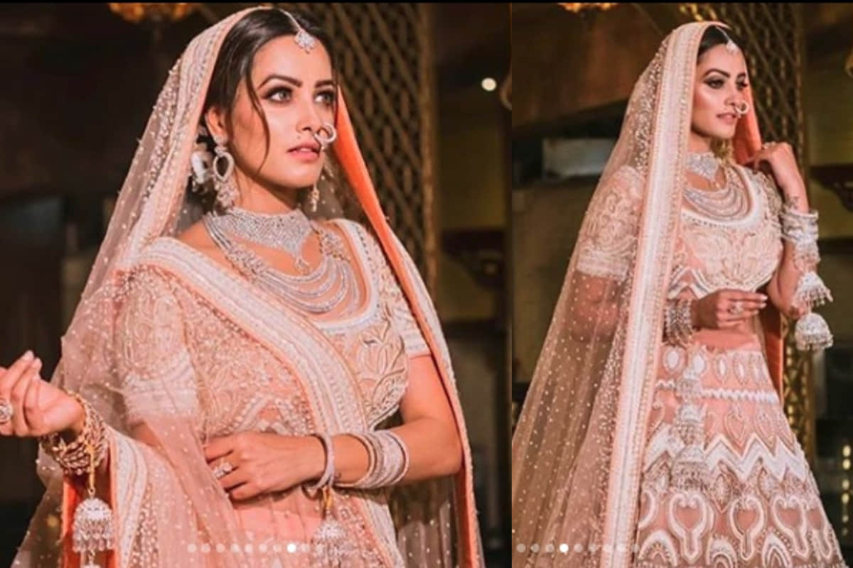 anita hassanandani stunning bridal look in dark green royal lehenga