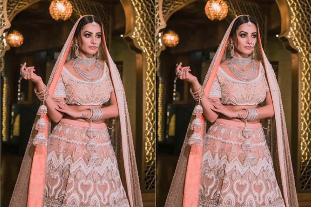 anita hassanandani stunning bridal look in dark green royal lehenga