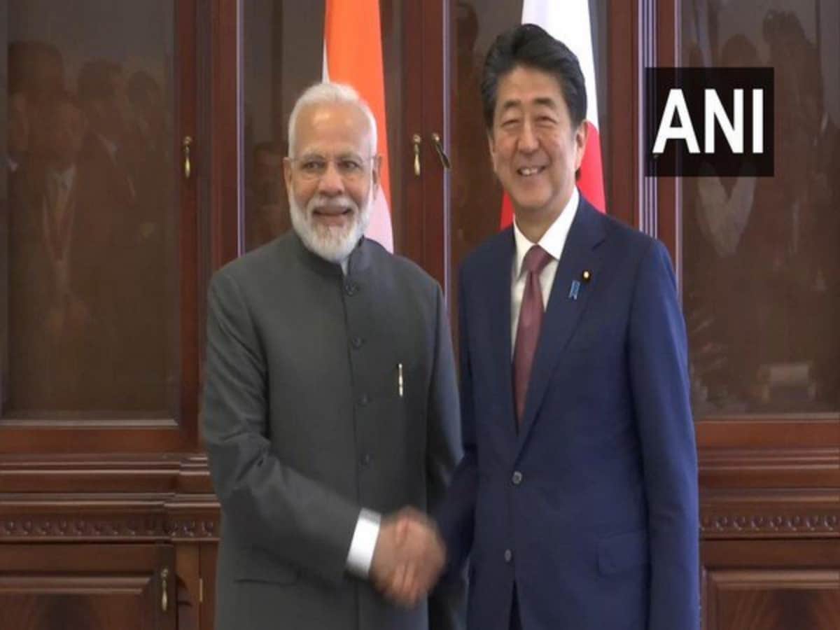 PM Modi meets Japan PM Shinzo Abe in Russia