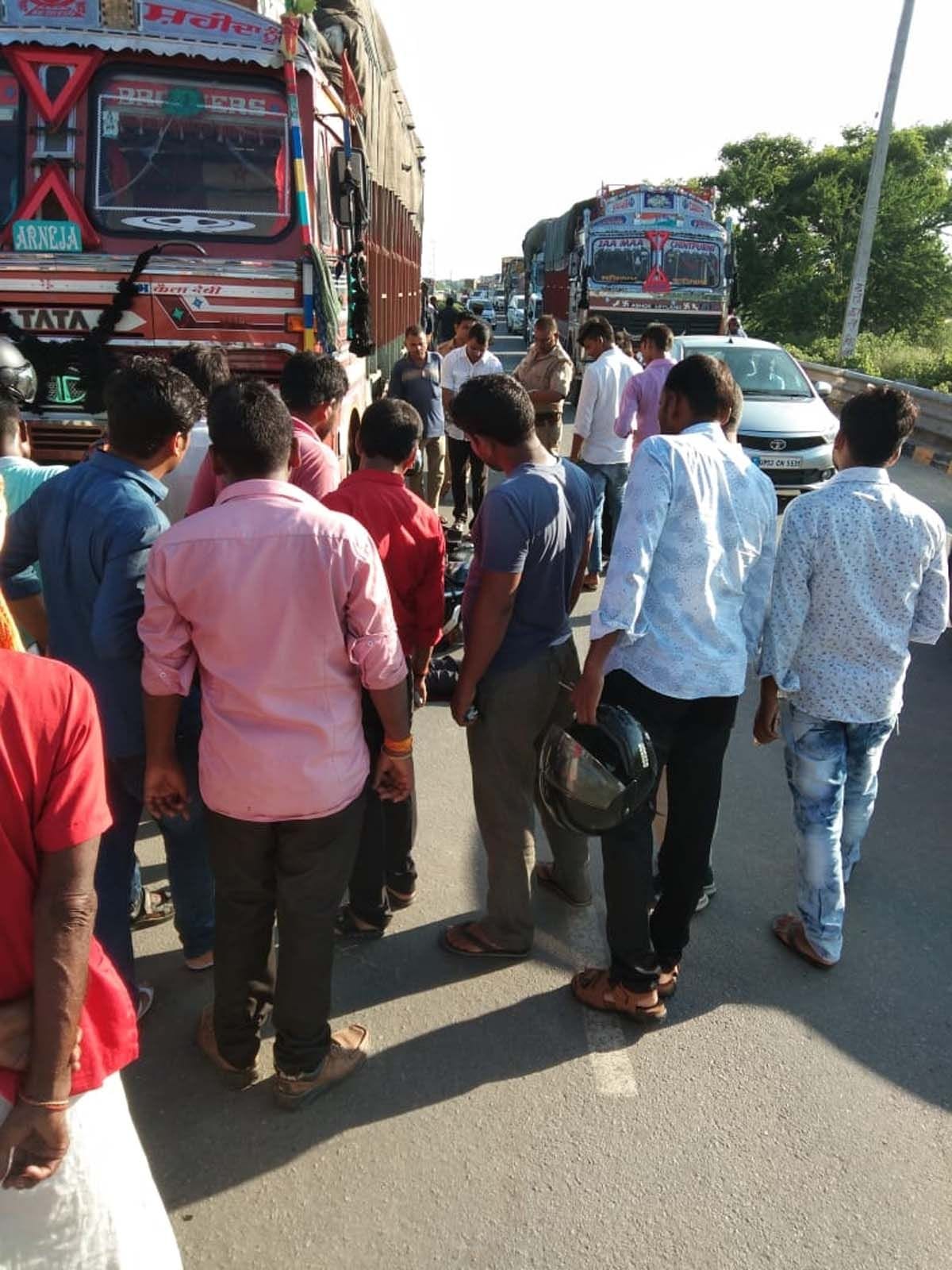 youth dies after being crused by a truck.