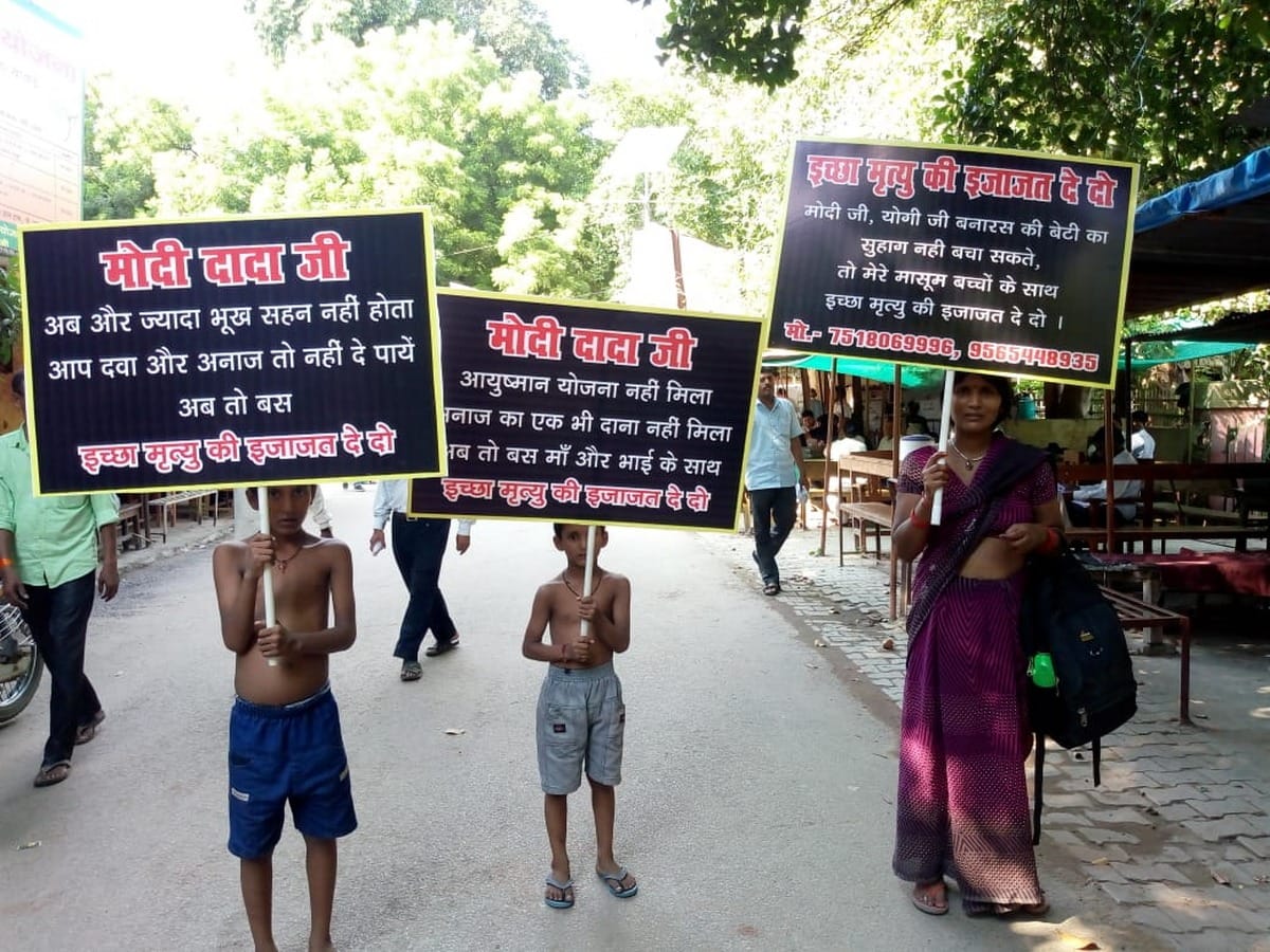 mother with two child Standing with placards in hand for wish death in varanasi