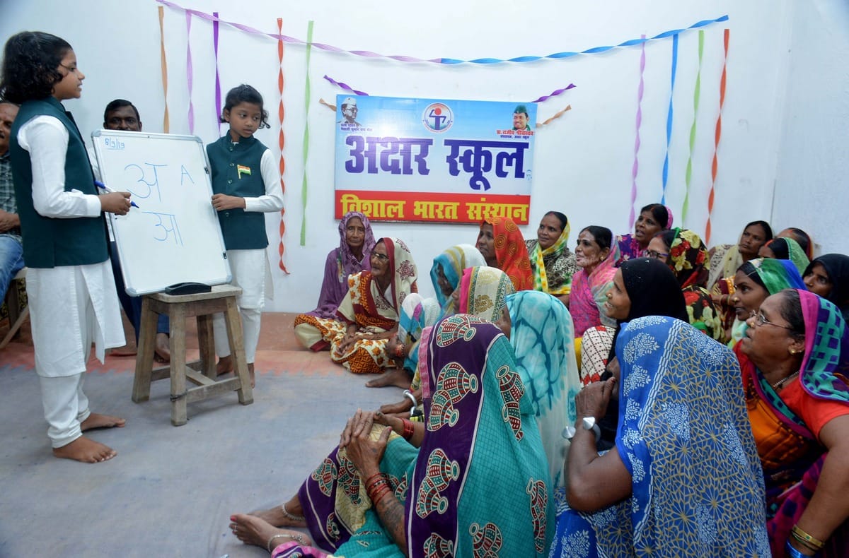 Akshar School open to teach elderly in Munshi Premchand village Lamahi World Literacy Day varanasi