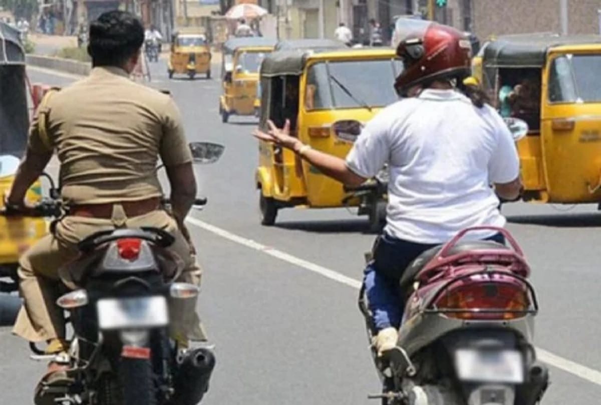 Police official issued challan for riding without helmet driving licence and insurance