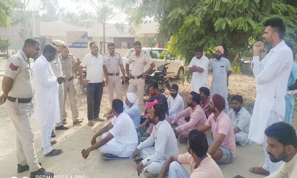 the villagers protesting in front of police station
